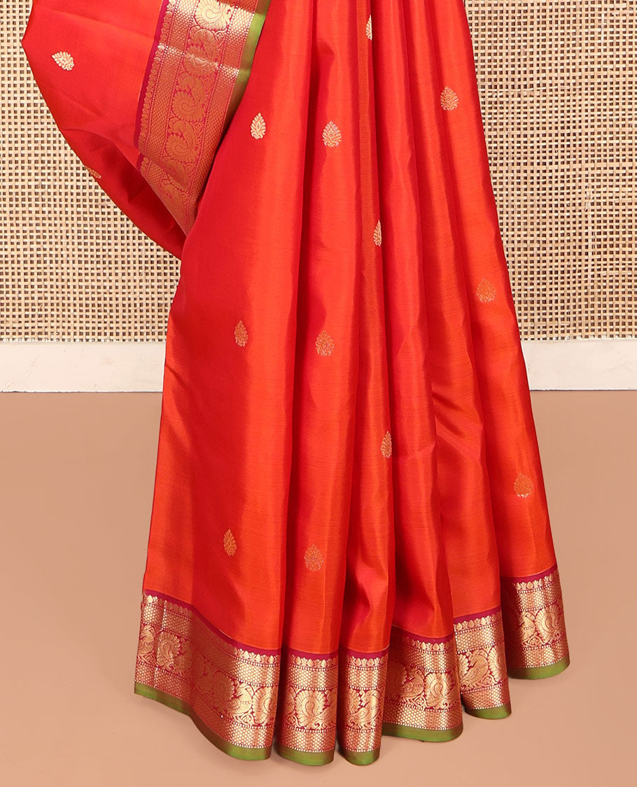 Orange Kanchipuram Silk Saree, Enthralled with Zari Buttas on Its Body, Complemented by a Contrast Border of Thilakam Mokku, Muthu, Mayil Kann, and Mayil Designs, Opulently Embellished Jaal Pallu, and Paired with a Contrast Blouse