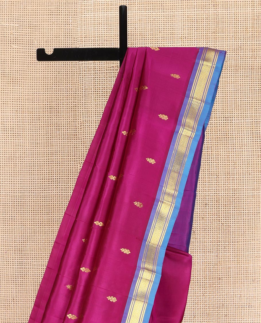 Magenta Kanchipuram Silk Saree, Adorned with Zari Buttas on Its Body, Complemented by a Contrast One-Sided Border of Banaras and Jaal Designs, Pallu Features Zari Designs, and Comes Without a Blouse