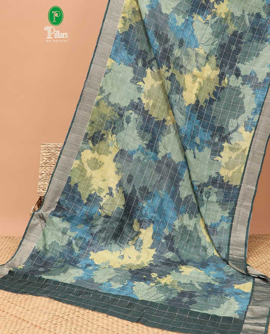 Green checks with floral printe semi tussar saree, gold zari bawanchi border & printed pallu along with checked blouse