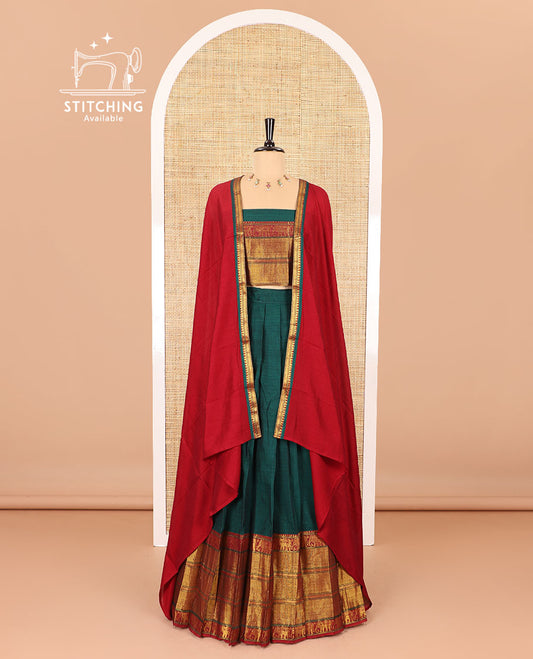 Dark green half-saree, plain with big contrast traditional zari motifs steeped border skirt, matching blouse and a plain zari border contrast dhavani