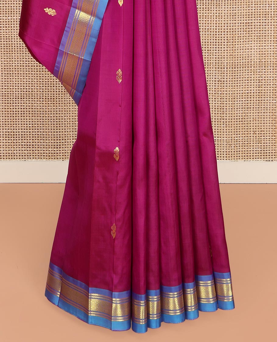 Magenta Kanchipuram Silk Saree, Adorned with Zari Buttas on Its Body, Complemented by a Contrast One-Sided Border of Banaras and Jaal Designs, Pallu Features Zari Designs, and Comes Without a Blouse