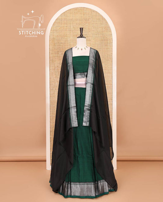 Bottle green Mercerised cotton half-saree, plain & contrast mayil kann temple border skirt, matching blouse & contrast zari border syska georgette dhavani