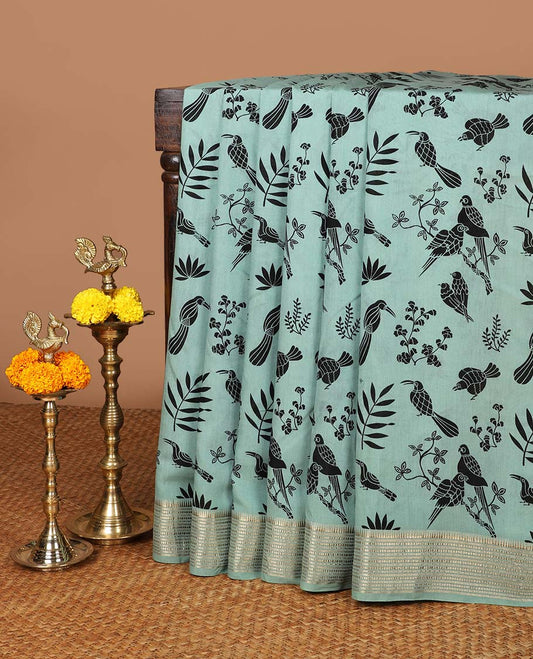 Pista green birds printed assam silk saree with zari striped border & chit pallu along with butta printed blouse