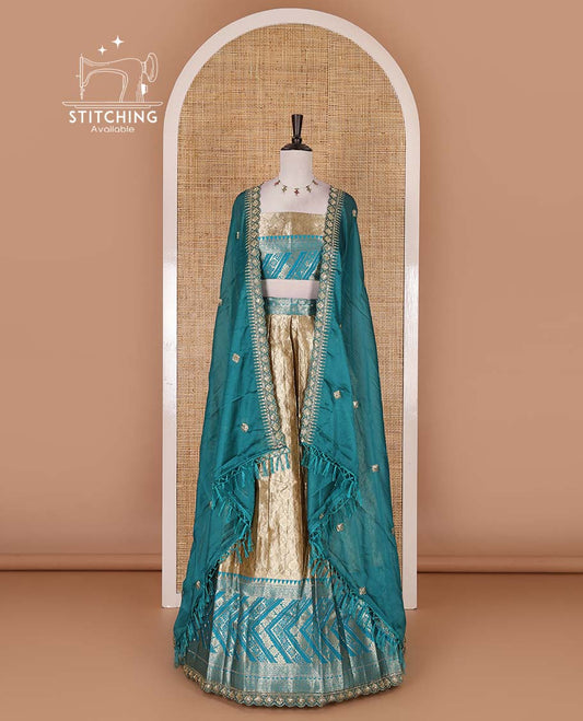 Gold banaras half saree, ogee skirt, contrast rama blue traditional zari border, matching blouse, and Syska georgette embroidered dhavani