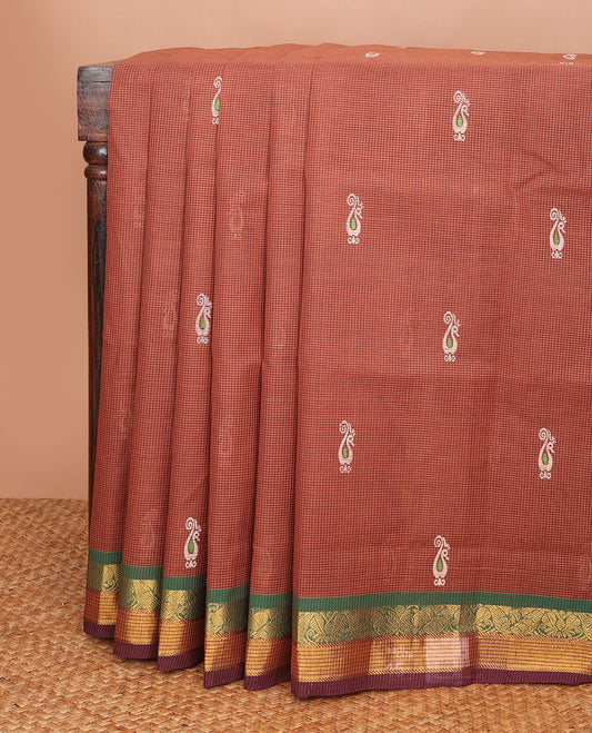 Brown micro-checked & peacock buttas Andhra cotton saree, contrast traditional border & chakra motif pallu