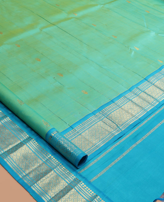 Turquoise Kanchipuram Silk Saree, Woven with Zari Buttas, a Contrast One-Sided Border of Panner Sombu, Banaras, Muthu, and Jaal Designs, Zari Design Pallu, and No Blouse