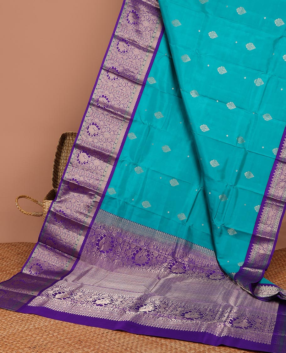 Blue floral buttas silk saree with contrast traditional zari design border & intricate zari design pallu