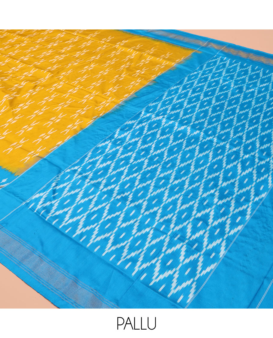 Mustard Ikkat Silk Saree, Masterfully Woven with Ikkat Buttas All Over Its Body, Complemented by a Contrast Diamond-Patterned Border, Pallu of Ikkat Butta Enclosed Checks, and Paired with a Contrast Blouse