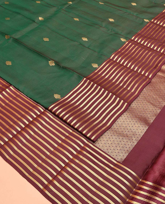 Green Vasundhara Lite Silk Mix Saree, Beautifully Bedecked with Zari Buttas All Over Its Body, Complemented by a Contrast Zari Striped Border, Grand Jaal-Design Pallu, and Paired with a Contrast Blouse