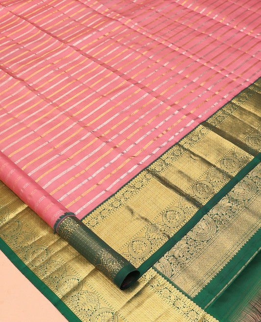 Pink Vasundhara Silk Saree, Embellished with Zari Stripes, a Contrast Border of Jaal, and Chakram Designs, a Diagonally Striped Pallu, and a Contrast Blouse