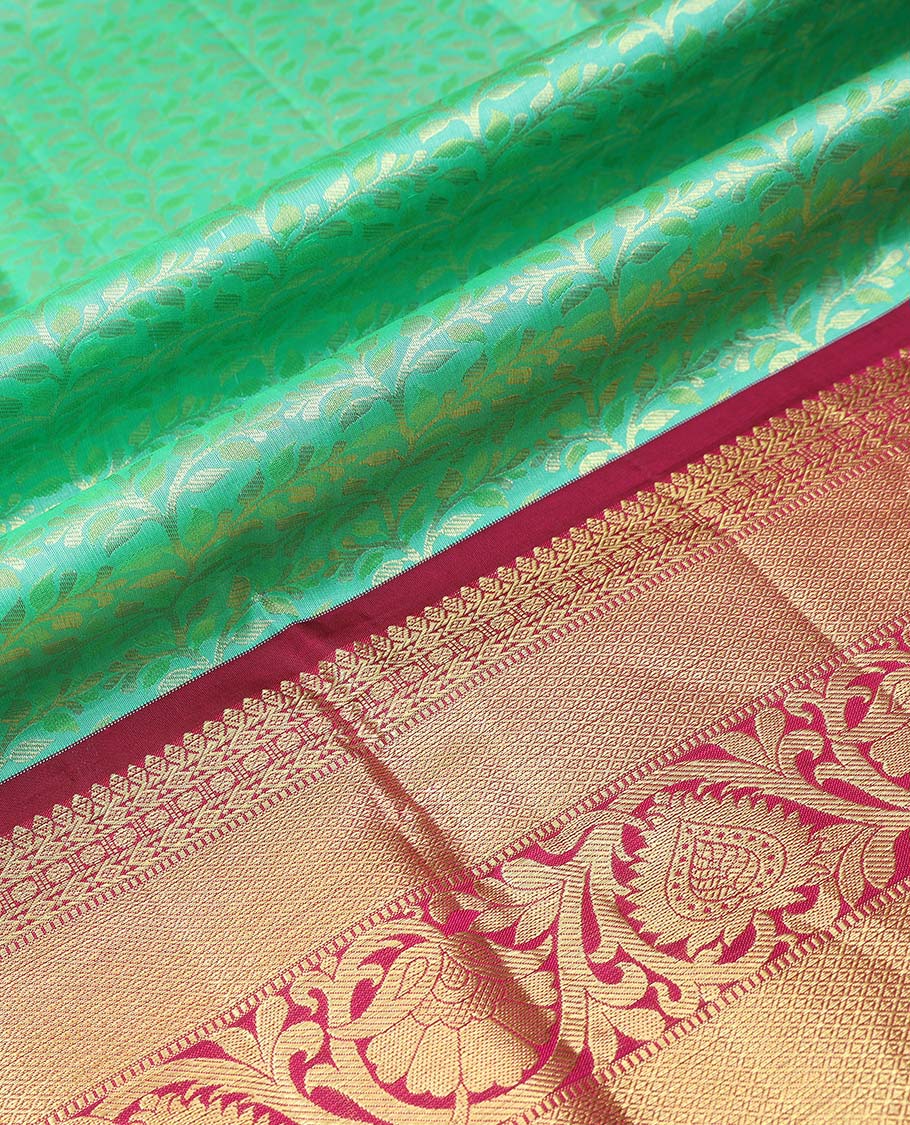 Green floral jacquard pure half silk saree with contrast zari border,  contrast zari design blouse & plain with zari border dhavani