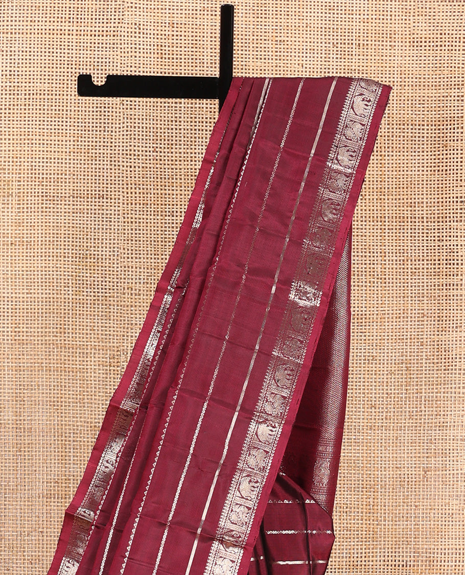 Maroon zari design Kanchipuram silk saree, zari border of reeku, kathir, muthu, yaanai, and mayil designs, and vanki design pallu