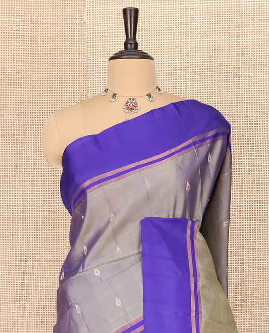 Grey Semi Uppada Saree Prettified with Zari Buttas, Complemented by a Contrast Zari Striped Border, Majestically Detailed Pallu of Jaal Designs, and Paired with a Contrast Blouse