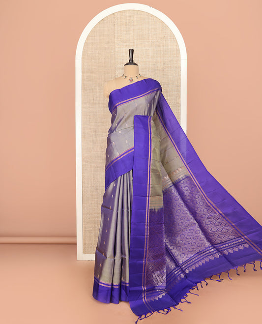 Grey Semi Uppada Saree Prettified with Zari Buttas, Complemented by a Contrast Zari Striped Border, Majestically Detailed Pallu of Jaal Designs, and Paired with a Contrast Blouse