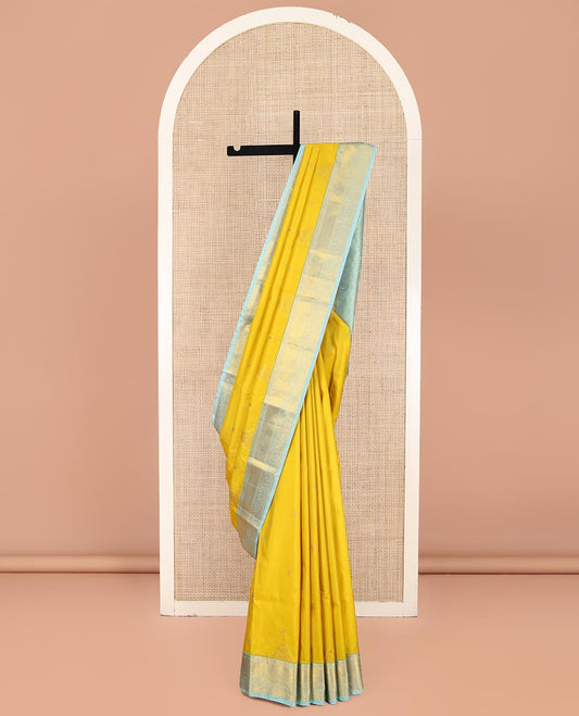 Yellow Budget Silk Saree, Sparsely Woven with Zari Buttas on Its Body, Complemented by Contrast Traditional Zari Border of Floral Creeper Designs, Intricately Designed Pallu, and Paired with a Contrast Blouse