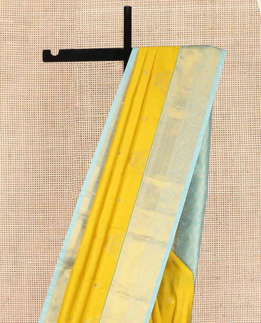 Yellow Budget Silk Saree, Sparsely Woven with Zari Buttas on Its Body, Complemented by Contrast Traditional Zari Border of Floral Creeper Designs, Intricately Designed Pallu, and Paired with a Contrast Blouse