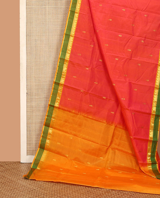 Orange striped and buttas Kanchipuram silk saree, contrast rettai pettu border of paneer sombu, vanki, and kathir designs, and zari design pallu