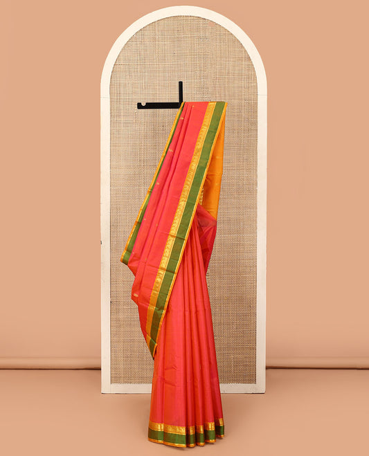Orange striped and buttas Kanchipuram silk saree, contrast rettai pettu border of paneer sombu, vanki, and kathir designs, and zari design pallu