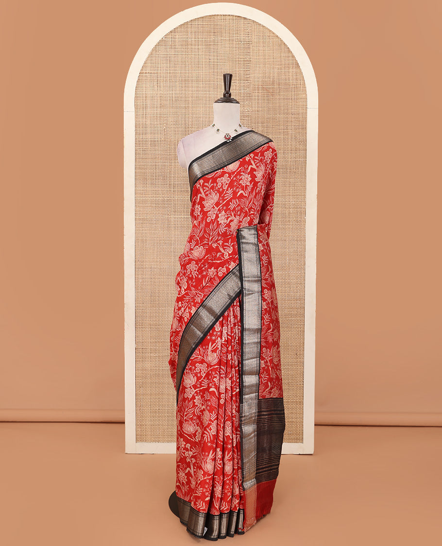 Red floral printed muga silk saree, contrast zari traditional temple border, and gleaming zari striped pallu