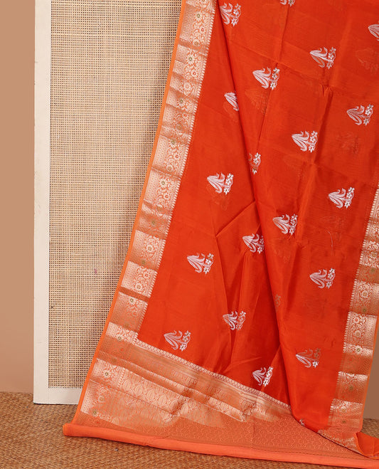 Red floral buttas raw mango silk saree, contrast traditional zari design border, and intricate pallu
