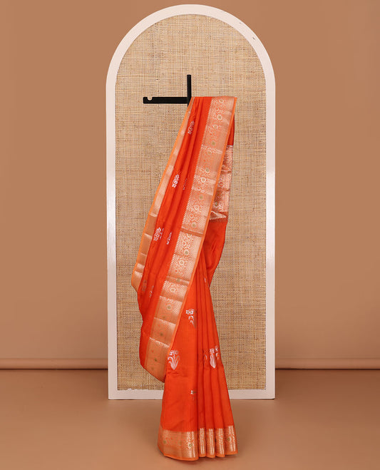 Red floral buttas raw mango silk saree, contrast traditional zari design border, and intricate pallu