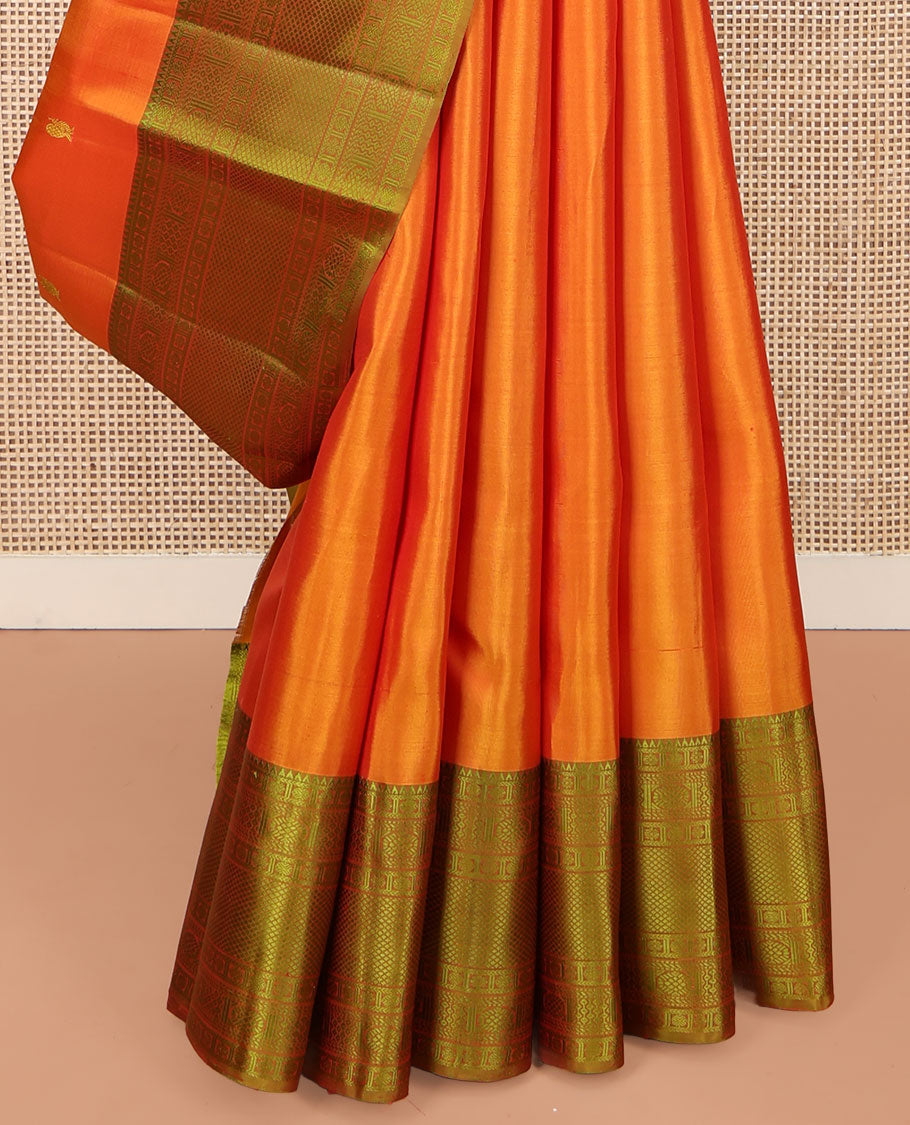 Orange Kanchipuram Silk Saree, Subtly Sparkled with Mayil-Chakram Buttas All Over Its Body, Complemented by a Contrast Border of Rekku, Kamalam, Poun, Chakram, Kuyil Kann, and Then Kuli Kann Designs, Jaal Design Pallu, and Paired with a Contrast Blouse