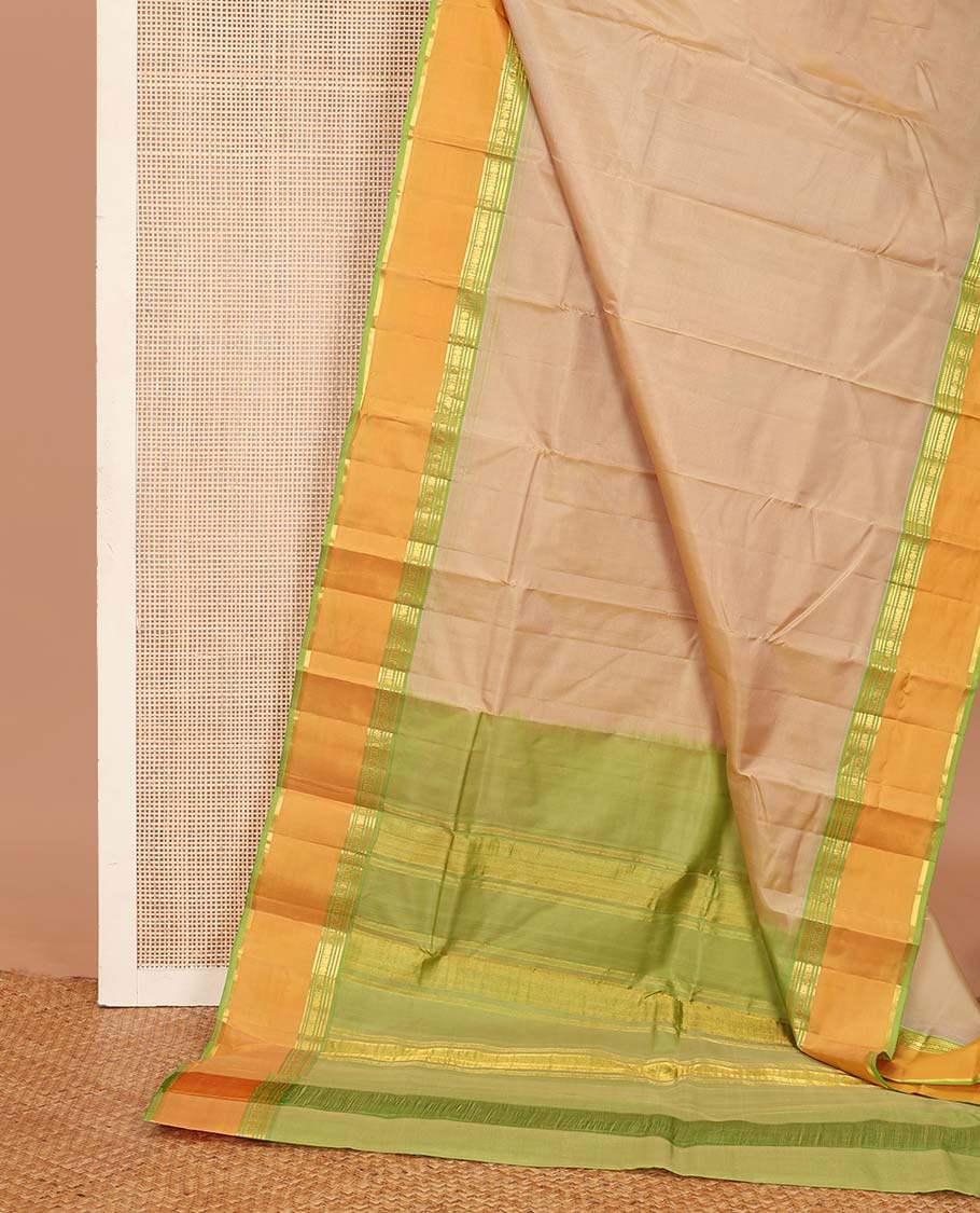Sandal plain Kanchipuram silk saree, contrast rettai pettu border of rekku, banaras, cross kamalam, and poun designs, and zari design pallu