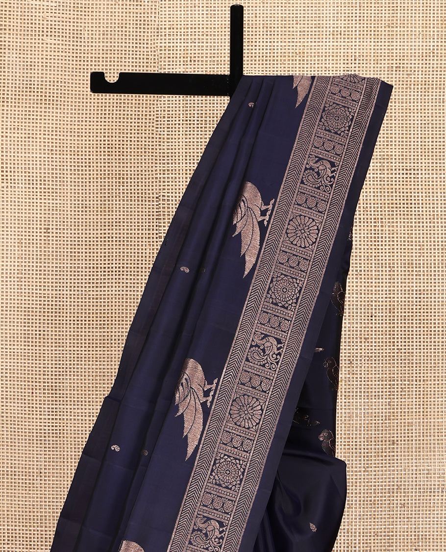 Blue Mayuri Soft Silk Saree, Finely Crafted with Buttas All Over Its Body, Highlighted by Self-Border of Parrot, Chakram, and Mayil Designs, Pallu Steeped with Parrot Designs, and Paired with a Matching Blouse