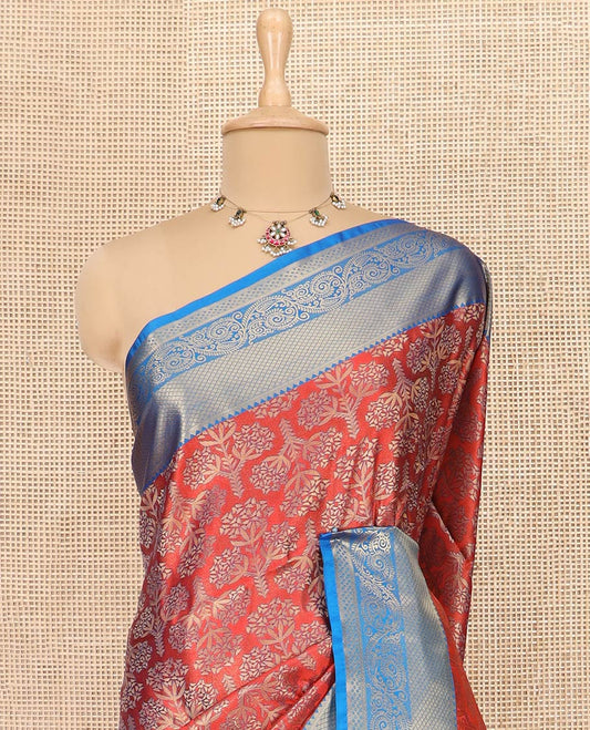 Red Semi-Soft Silk Saree Artfully Detailed with Floral Designs, Complemented by Contrast Traditional Zari Design Border, Pallu Steeped with Intricate Designs, and Paired with a Contrast Blouse