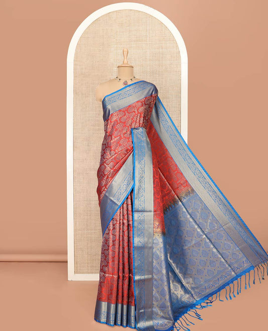 Red Semi-Soft Silk Saree Artfully Detailed with Floral Designs, Complemented by Contrast Traditional Zari Design Border, Pallu Steeped with Intricate Designs, and Paired with a Contrast Blouse