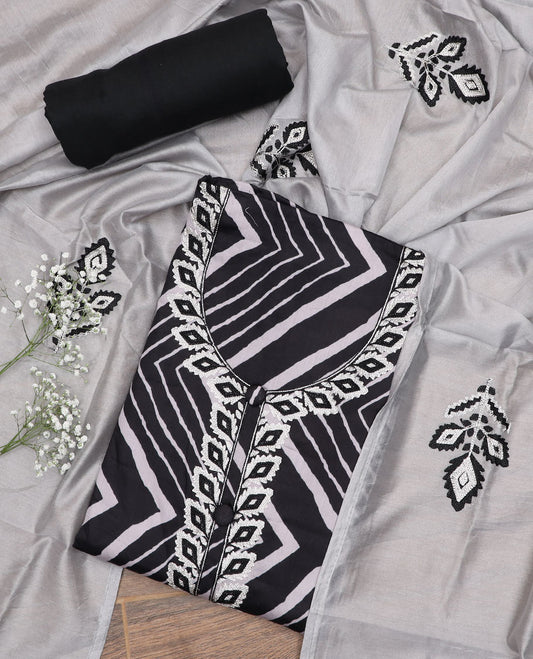 Black material chudidar set, chevron printed with neck embroidered top, plain bottom, and floral embroidered dupatta