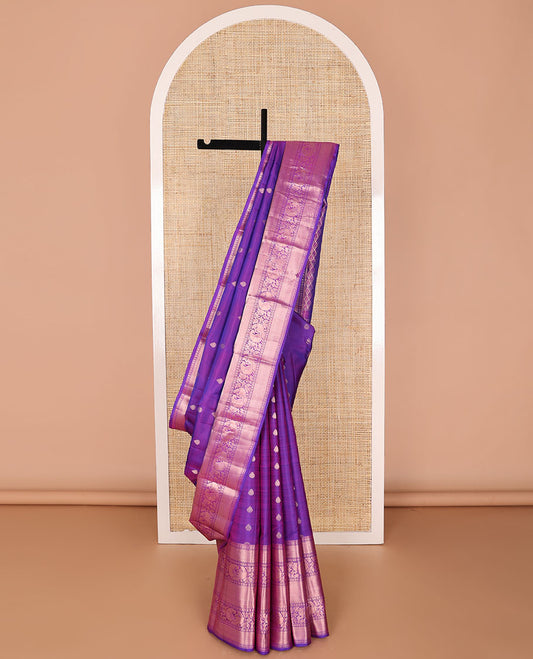 Purple buttas silk saree with self border of thilakam mokku, paun, mayil, vanki design & zari design pallu