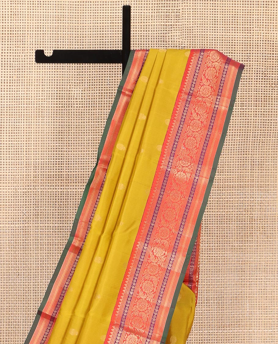 Yellow Vasundhara Silk Saree, Featuring Zari Buttas All Over Its Body, Complemented by a Contrast Border of Thilakam, Manga, Kamalam, Kathir, and Kodi Visiry Designs, Grand Jaal Pallu, and Paired with a Contrast Blouse