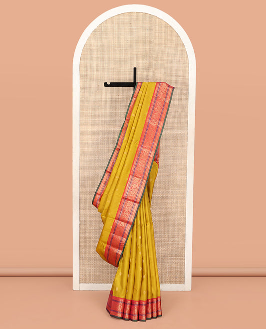 Yellow Vasundhara Silk Saree, Featuring Zari Buttas All Over Its Body, Complemented by a Contrast Border of Thilakam, Manga, Kamalam, Kathir, and Kodi Visiry Designs, Grand Jaal Pallu, and Paired with a Contrast Blouse