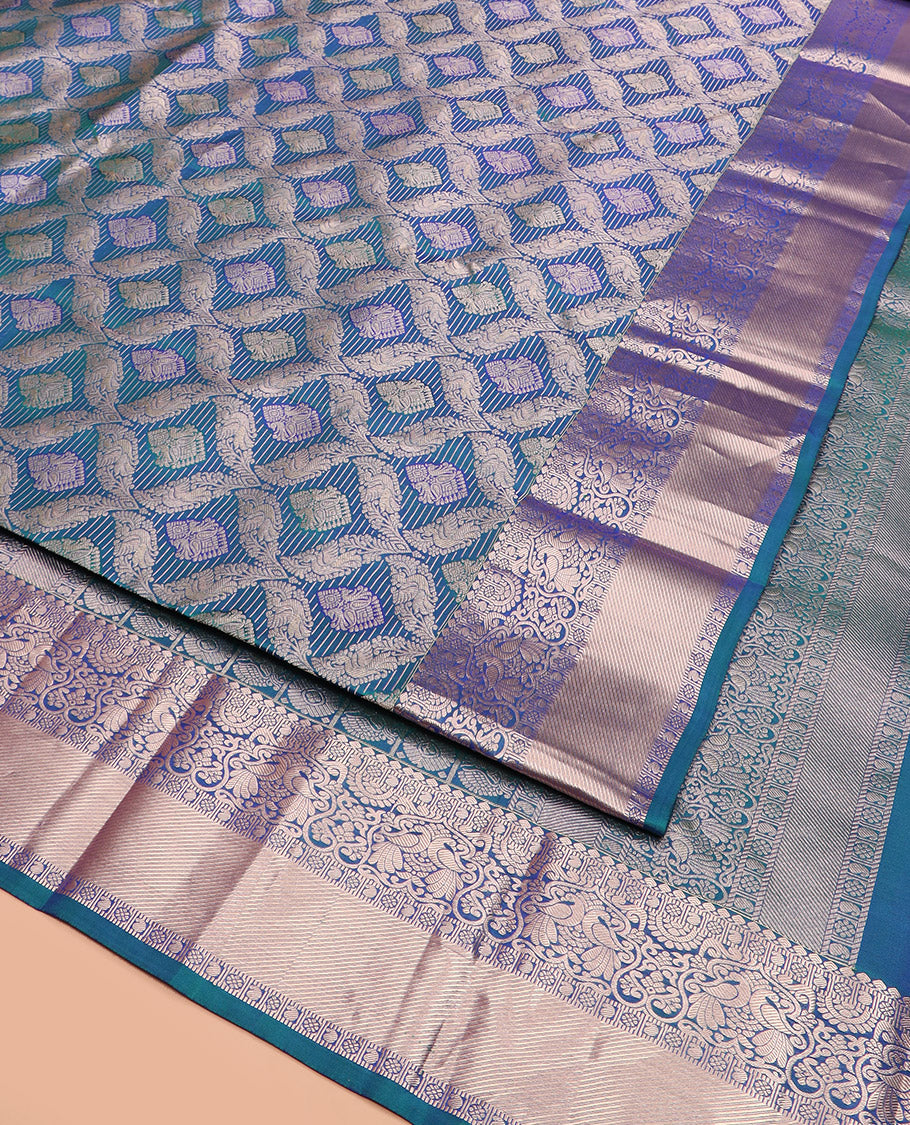 Blue Kanchipuram Wedding Silk Saree Graced with Ogee Jacquard Design, Complemented by Zari Border Featuring Thilakam Mokku, Kamalam, Manga, and Mayil Designs, Opulently Detailed Pallu of Annam Charkam Enclosed Checks, and Paired with a Matching Blouse