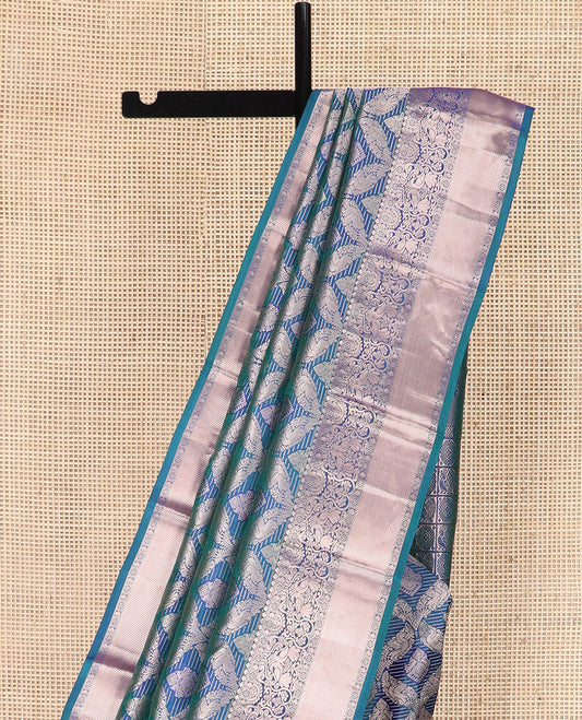 Blue Kanchipuram Wedding Silk Saree Graced with Ogee Jacquard Design, Complemented by Zari Border Featuring Thilakam Mokku, Kamalam, Manga, and Mayil Designs, Opulently Detailed Pallu of Annam Charkam Enclosed Checks, and Paired with a Matching Blouse