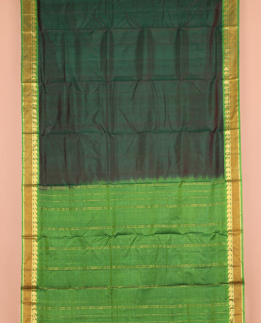 Green striped nine-yard silk saree, contrast rettai pettu border of mayil manga, and kathir designs, and zari striped pallu