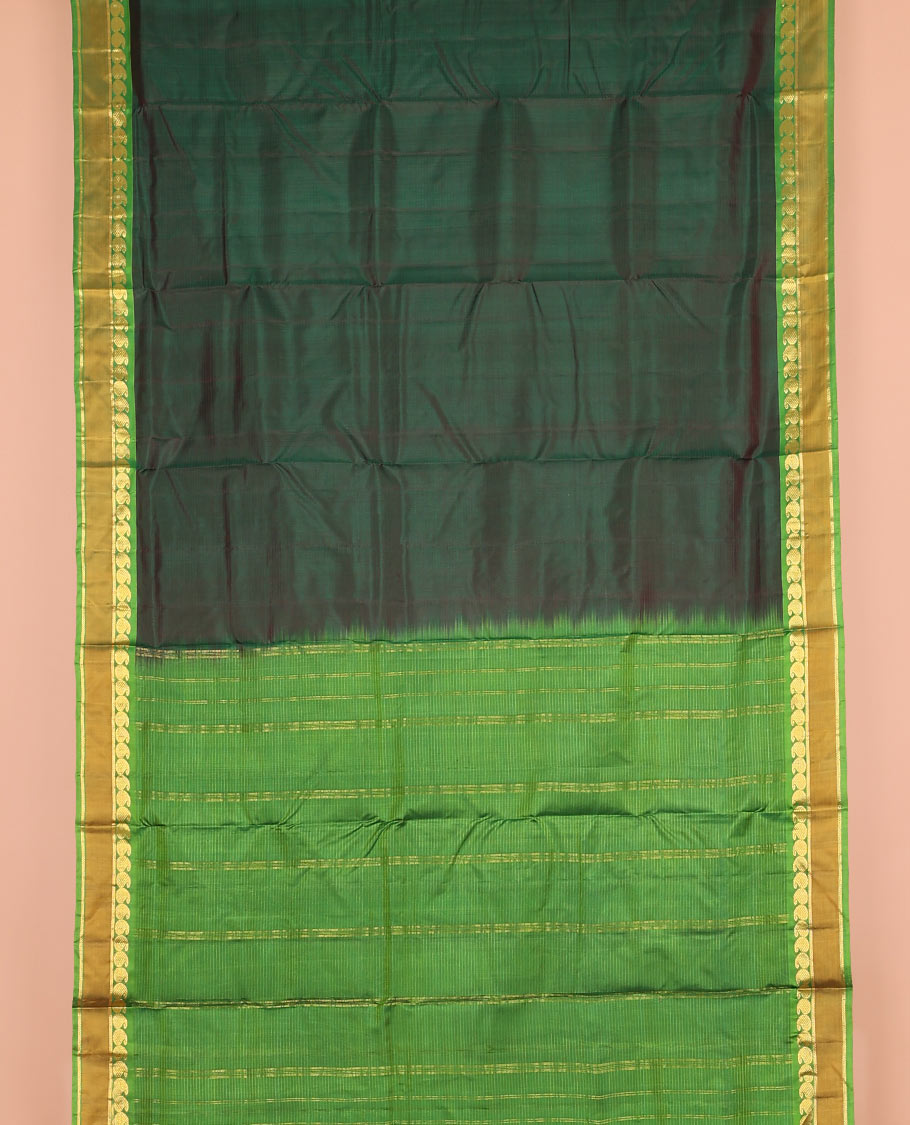 Green striped nine-yard silk saree, contrast rettai pettu border of mayil manga, and kathir designs, and zari striped pallu