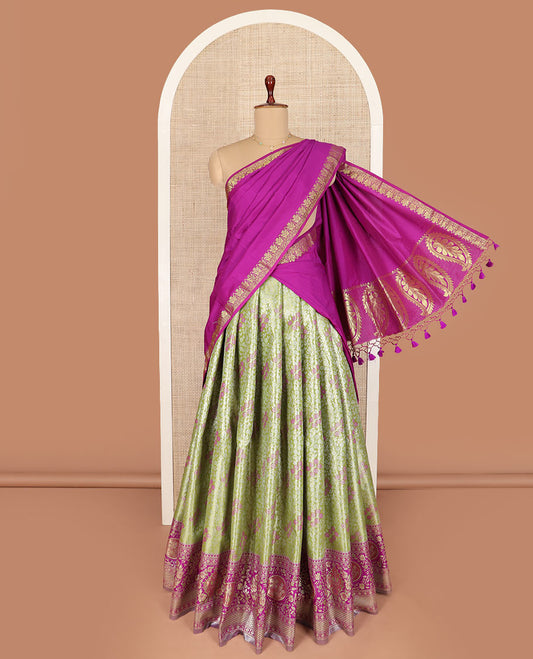 Green Art Silk Half-Saree Richly Detailed with Jacquard Designs on Its Skirt, Complemented by a Contrast Meenakari Border, Paired with a Contrast Jacquard Blouse, and Featuring a Dhavani Adorned with Paisley Motifs