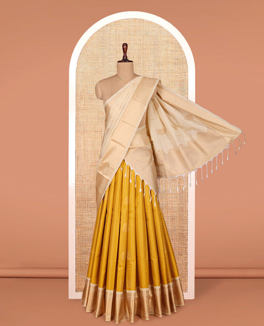 Mustard Art Silk Material Half Saree Set, Embellished with Zari Buttas and Checks on Its Skirt, Complemented by Contrast Traditional Zari Design Border, Paired with a Contrast Blouse, and an Intricately Designed Dhavani