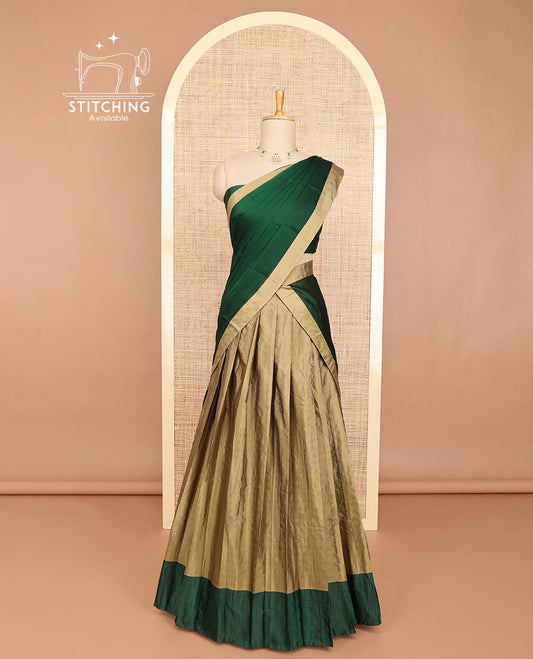 Pale brown striped half saree with contrast border, plain blouse & plain, checked border dhavani