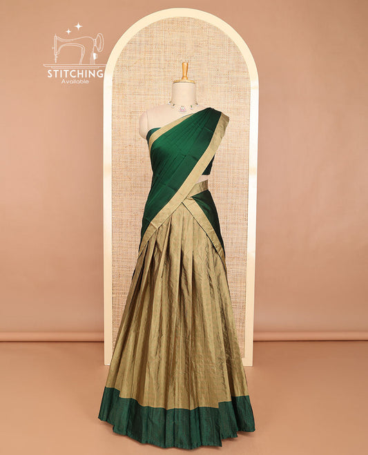 Pale brown striped half saree with contrast border, plain blouse & plain, checked border dhavani