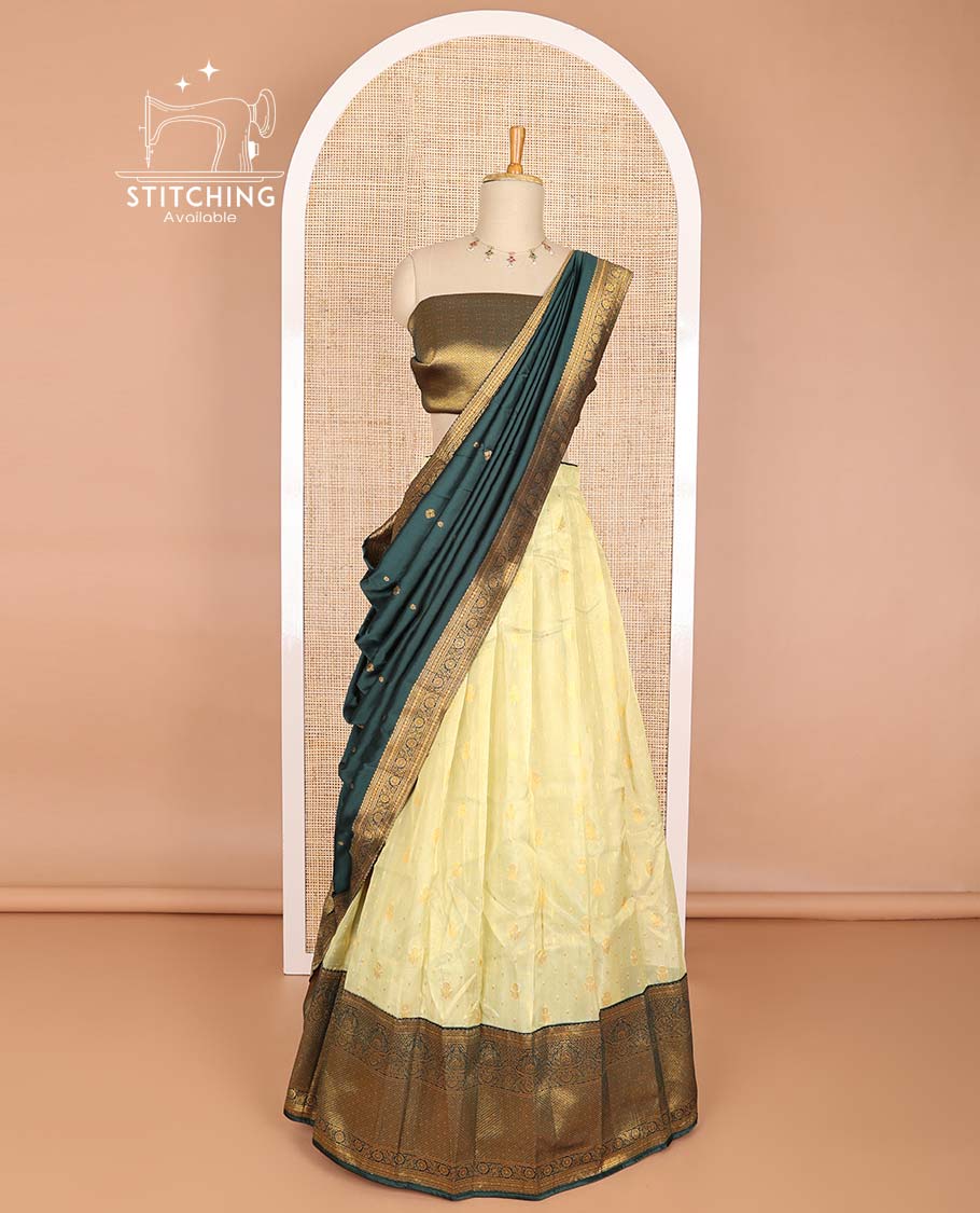 Lemon yellow buttas half saree with contrast intricate zari design border, jaal design blouse & floral design dhavani