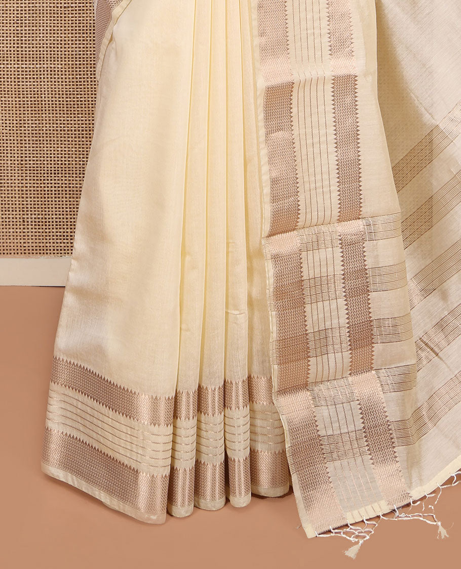 Cream Plain Assam Silk Saree, Highlighted by a Traditional Zari Border, Zari-Striped Pallu, and a Matching Blouse
