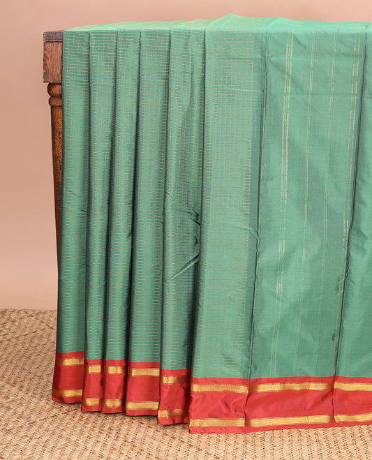 Green checked gift saree with contrast rettai pettu zari border & striped pallu