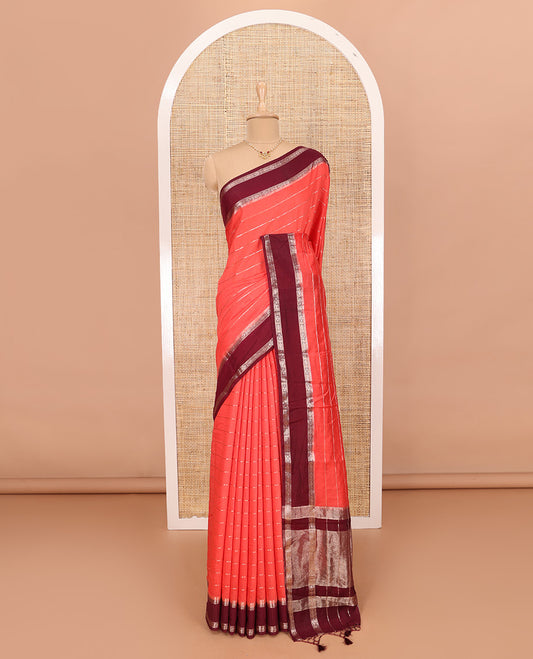 Peach Assam Silk Saree Embellished with Zari Stripes, Complemented with a Contrast Traditional Design Border, Zari-Elevated Pallu, and Paired with a Contrast Blouse