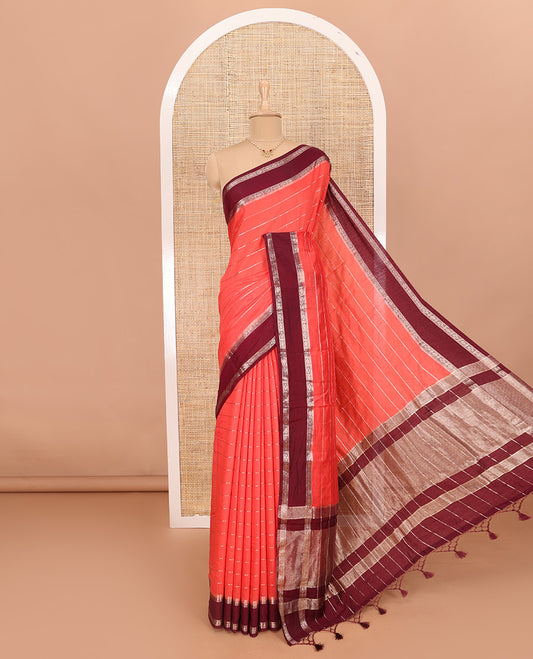 Peach Assam Silk Saree Embellished with Zari Stripes, Complemented with a Contrast Traditional Design Border, Zari-Elevated Pallu, and Paired with a Contrast Blouse