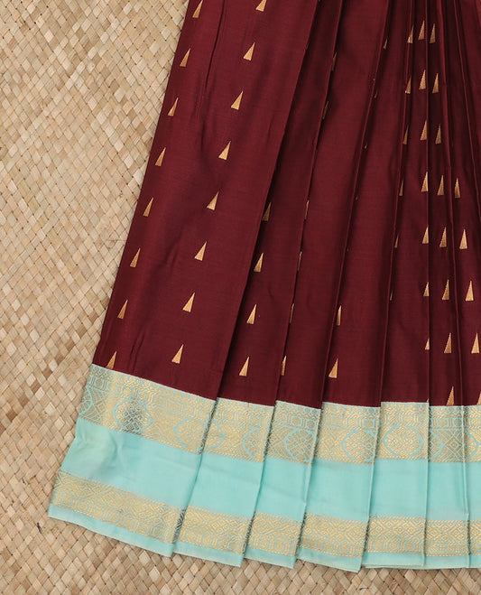 Maroon Budget Silk Saree Highlighted with Triangle Zari Buttas, Complemented with a Contrast Traditional Zari Design Rettai Pettu Border, Gleaming Jaal Pallu, and Paired with a Contrast Blouse