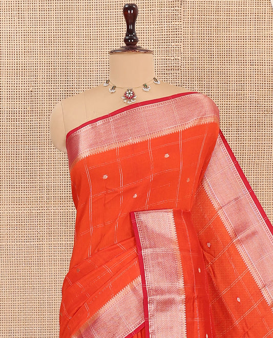 Orange Assam Silk Saree, Highlighted by Zari Butta Enclosed Checked Design, Complemented by Contrast Zari Border of Traditional Designs, Pallu Features Zari Designs, and Paired with a Contrast Blouse