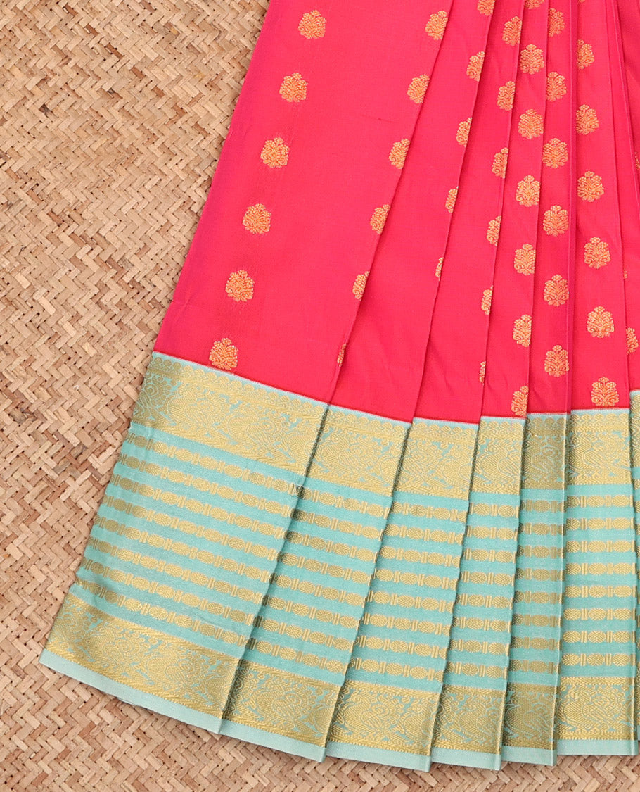 Pink Budget Silk Saree, Artfully Detailed with Zari Buttas All Over Its Body, Complemented by a Contrast Traditional Zari Border of Peacock Designs, Opulently Embellished Pallu of Jaal Designs, and Paired with a Contrast Blouse